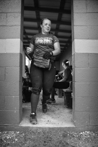 Rachel Holloway, Lady Cougars senior, runs from the dugout in the moments before the team’s game against Claiborne County. photo by Emilee Lamb - 2015