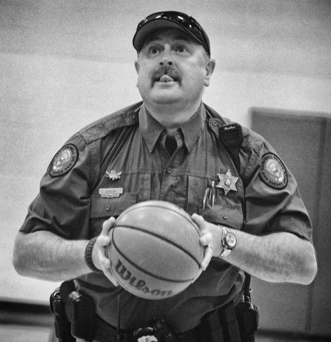 School Resource Offi cer Jeff Allen of the Campbell County Sheriffʼs Offi ce plays basketball with the Jacksboro Elementary students. photo by Brianna Bivens - 2016