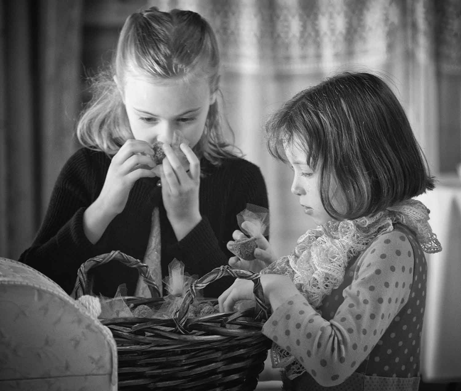 Marissa Fogg and Lara Calhoun smell lavender-scented decorations before the wedding.