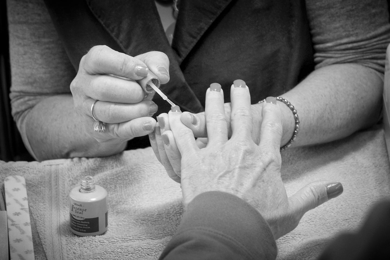 Susie Nelson paints nails at the Xpress Salon. photo by Emily Ross - 2016