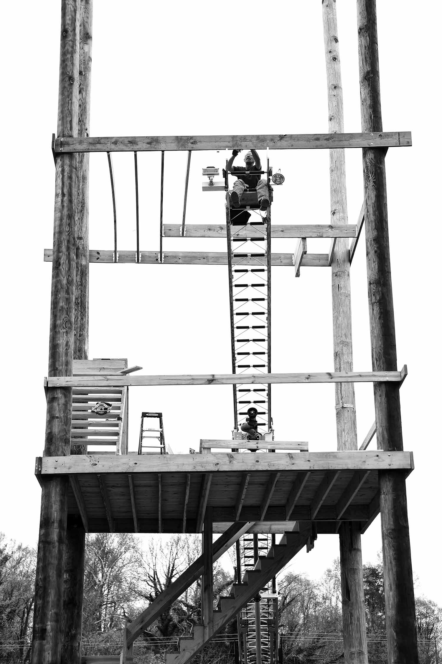 Assistant fire chief Jimmy Pack works on constructing a fire tower for training firefighters. photo by Kellie Ward - 2019