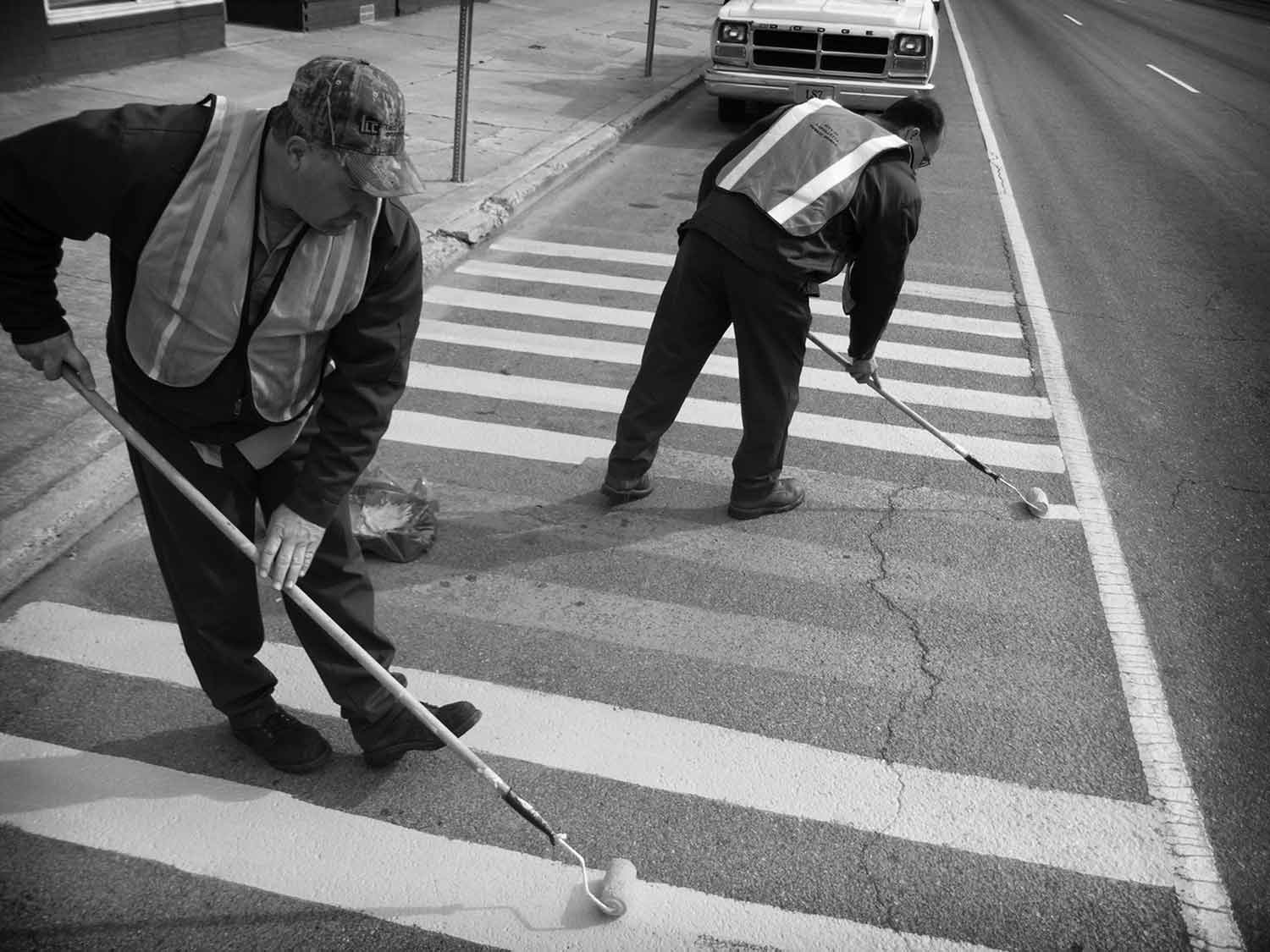 Ray Bostic and Tony Huddleston repaint the no-parking zone on Highway 25 at the corner of Tennessee Avenue. photo by Steve Metz - 2004