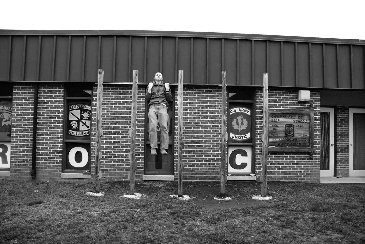 Cameron McDonald demonstrates the use of the ROTC pull-up bars in front of the ROTC room. He does about ten without breaking a sweat. photo by James Bolton - 2009