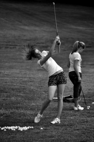 Marie Roach (left) Rachel Heatherly (right) practice their swings. photo by Jonathan Barrow - 2010