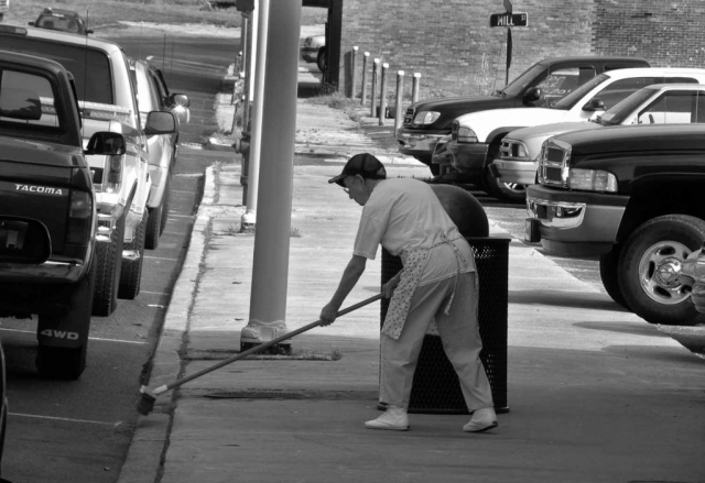 Mildred Weldon sweeps a sidewalk on Tennessee Ave. photo by Jonathan Kahler - 2010