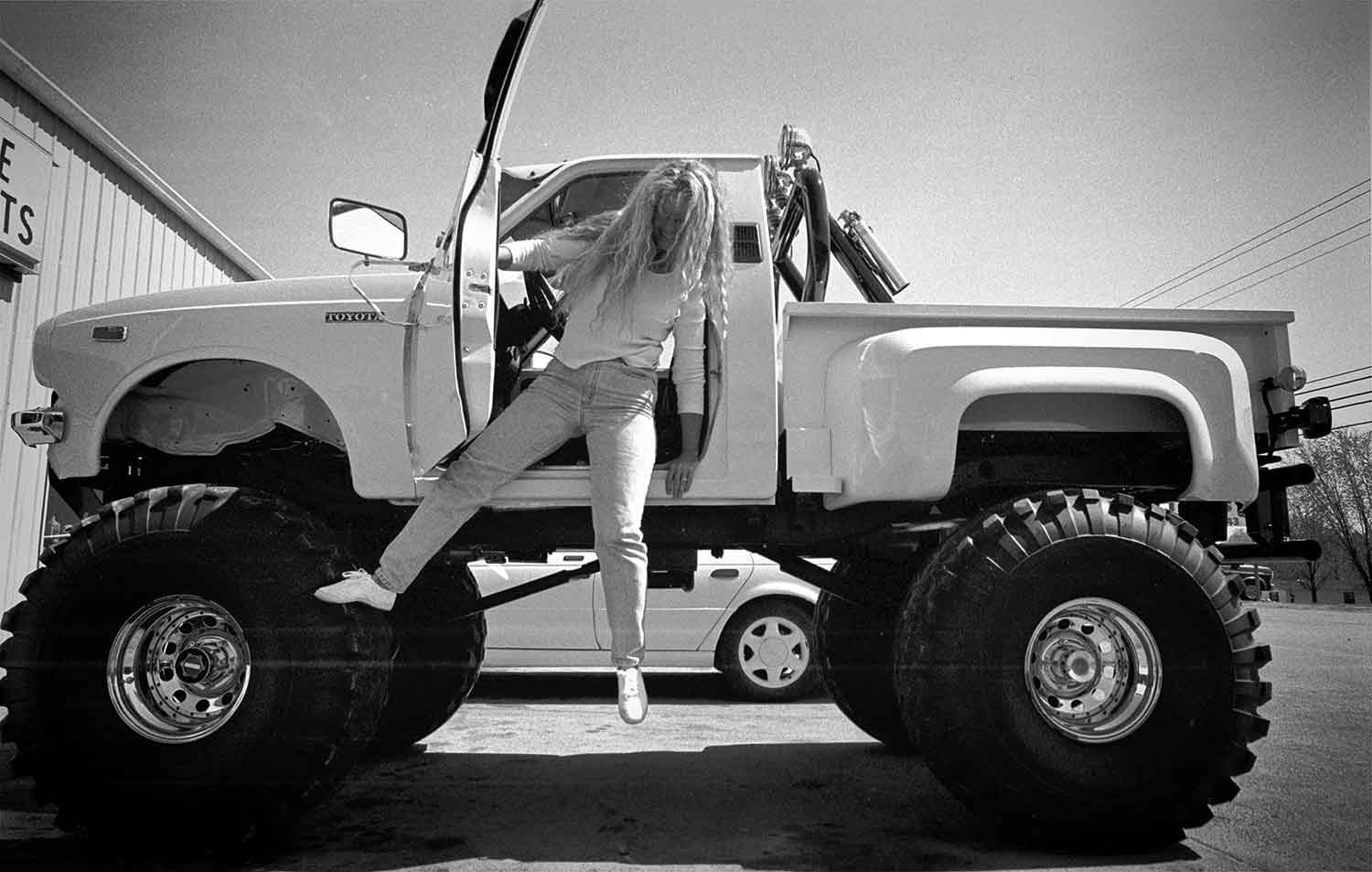 Ann Smiddy attempts to gracefully exit her Toyota Truck. photo by Rob Heller - 1997