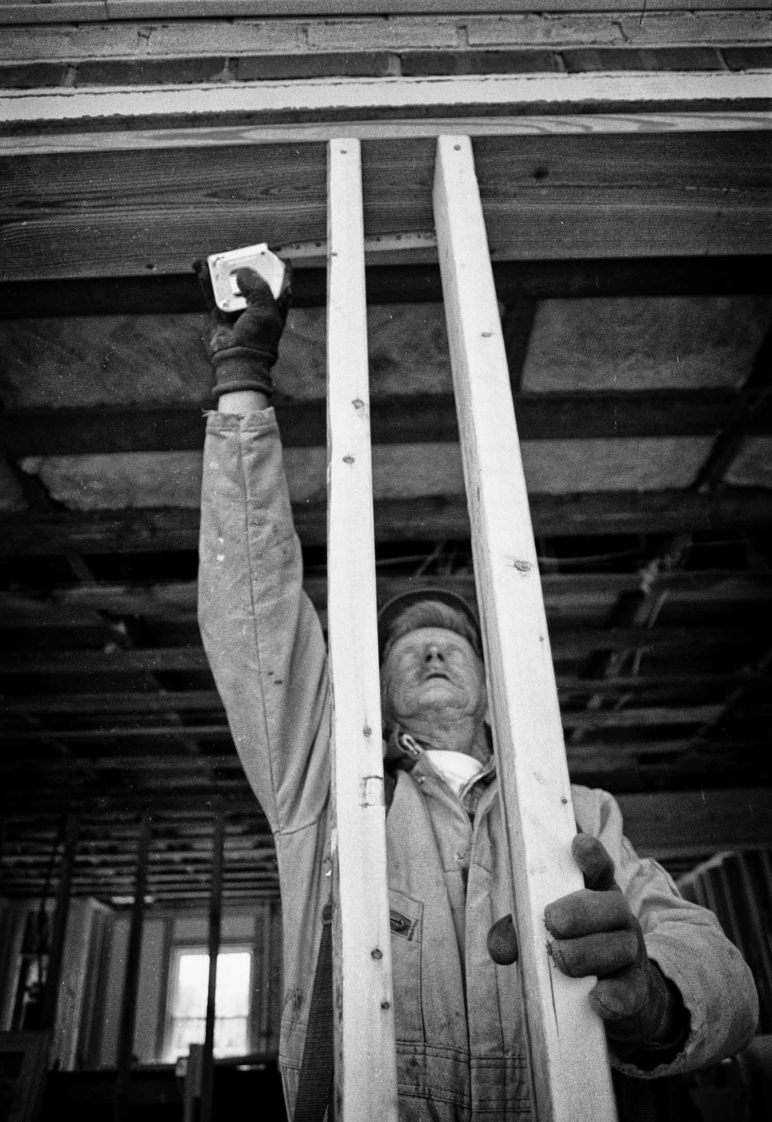 Wayne Eubanks of Jacksboro prepares to install a window. photo by Cory Soldwedel - 1999