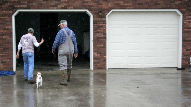 Matt Mitchell and his grandfather, Ronald Greene, talk about the farming and about the rain. photo by Brandon Ball - 2008