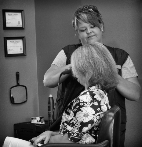 Sixth grade teacher, Kim Fairchild, relaxes at Villa Salon as Kim Oakes styles her hair. photo by Anne Huffman - 2010