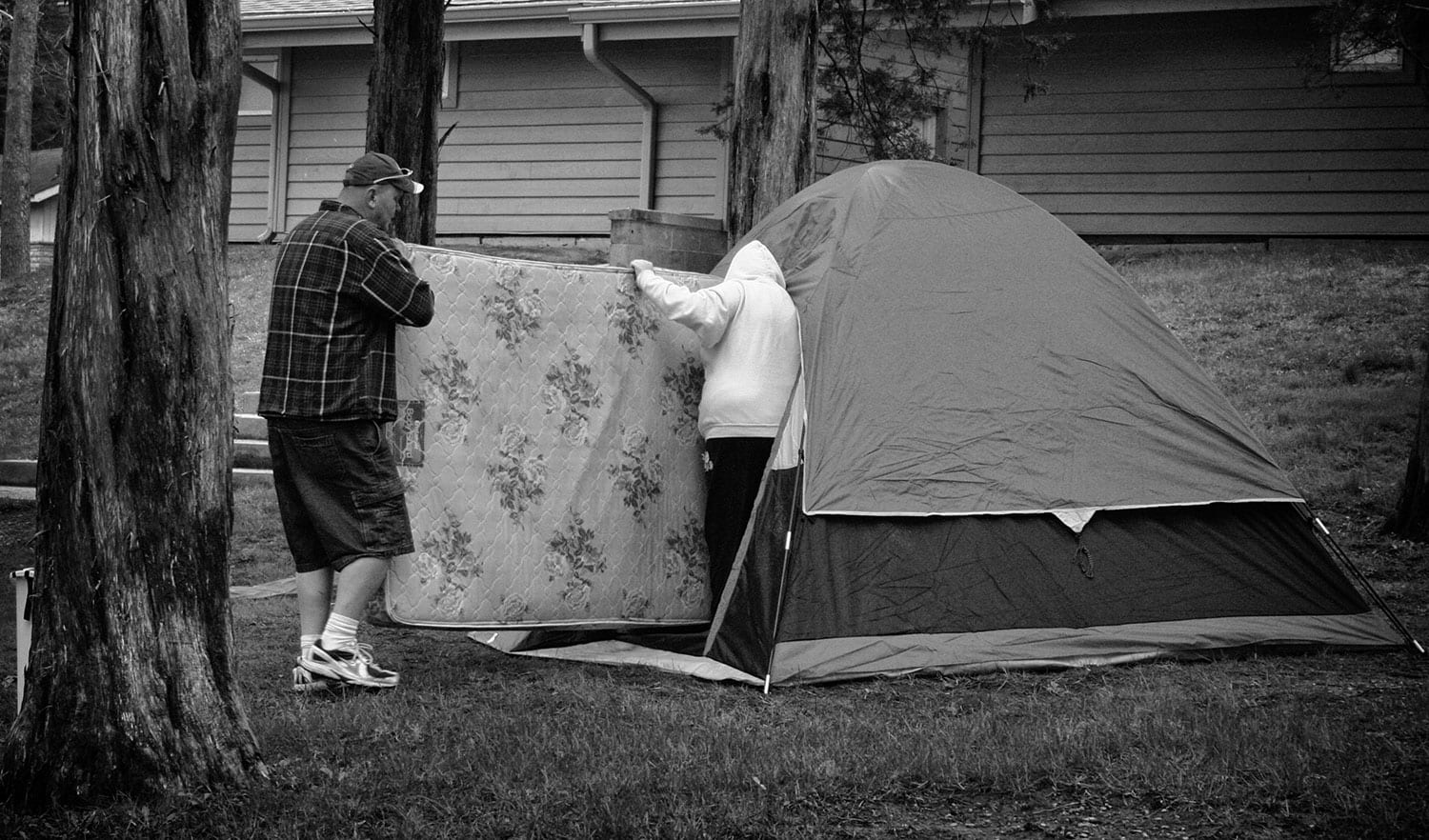 Shane Humerick and Brittany Partin set up their tent in Cove Lake Park Campground. photo by Ben Moser - 2009