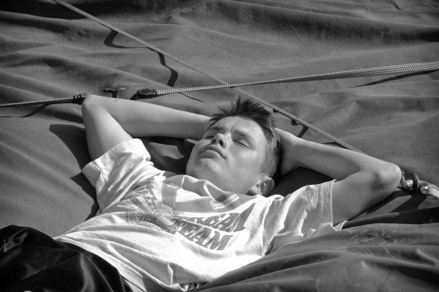 Oleg Piven relaxes during a break in his high school track practice. photo by Justin Hornkohl - 2005